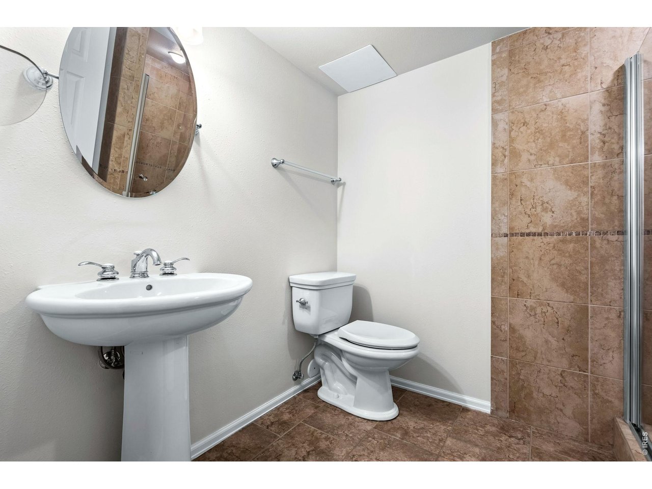 4133 Sumter Square Fort Collins, CO 80525 - Photo 33 of 42 a bathroom with a sink and a mirror