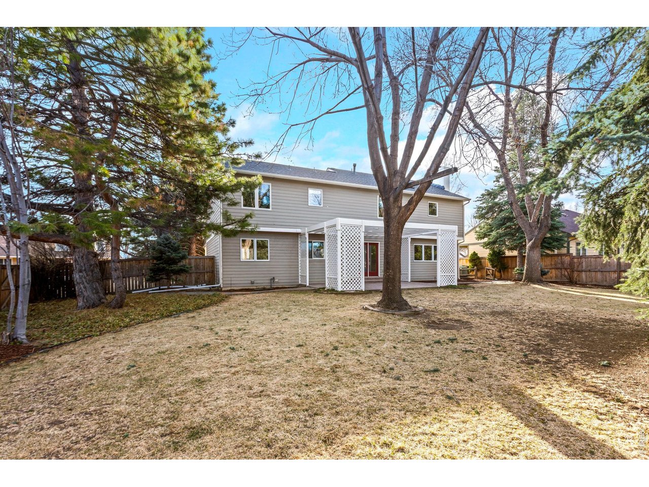 4133 Sumter Square Fort Collins, CO 80525 - Photo 35 of 42 a front view of a house with a yard