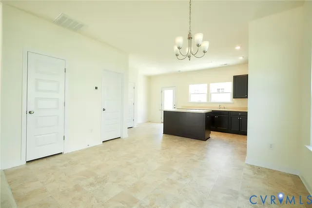 a view of a kitchen with a sink and dishwasher cabinet