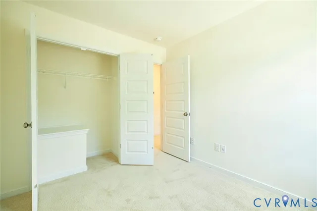 an empty room with closet area
