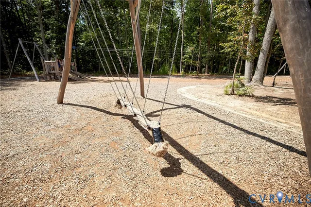 a wooden bench sitting next to a road