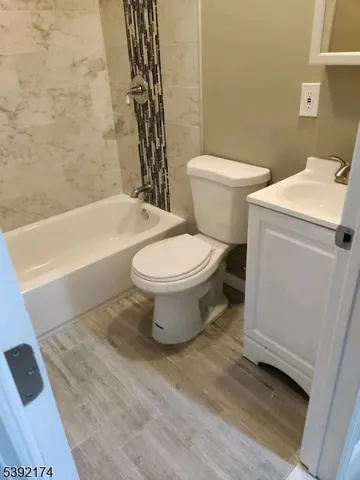 a bathroom with a toilet and a bathtub