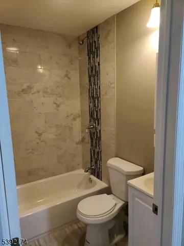 a bathroom with a toilet and shower