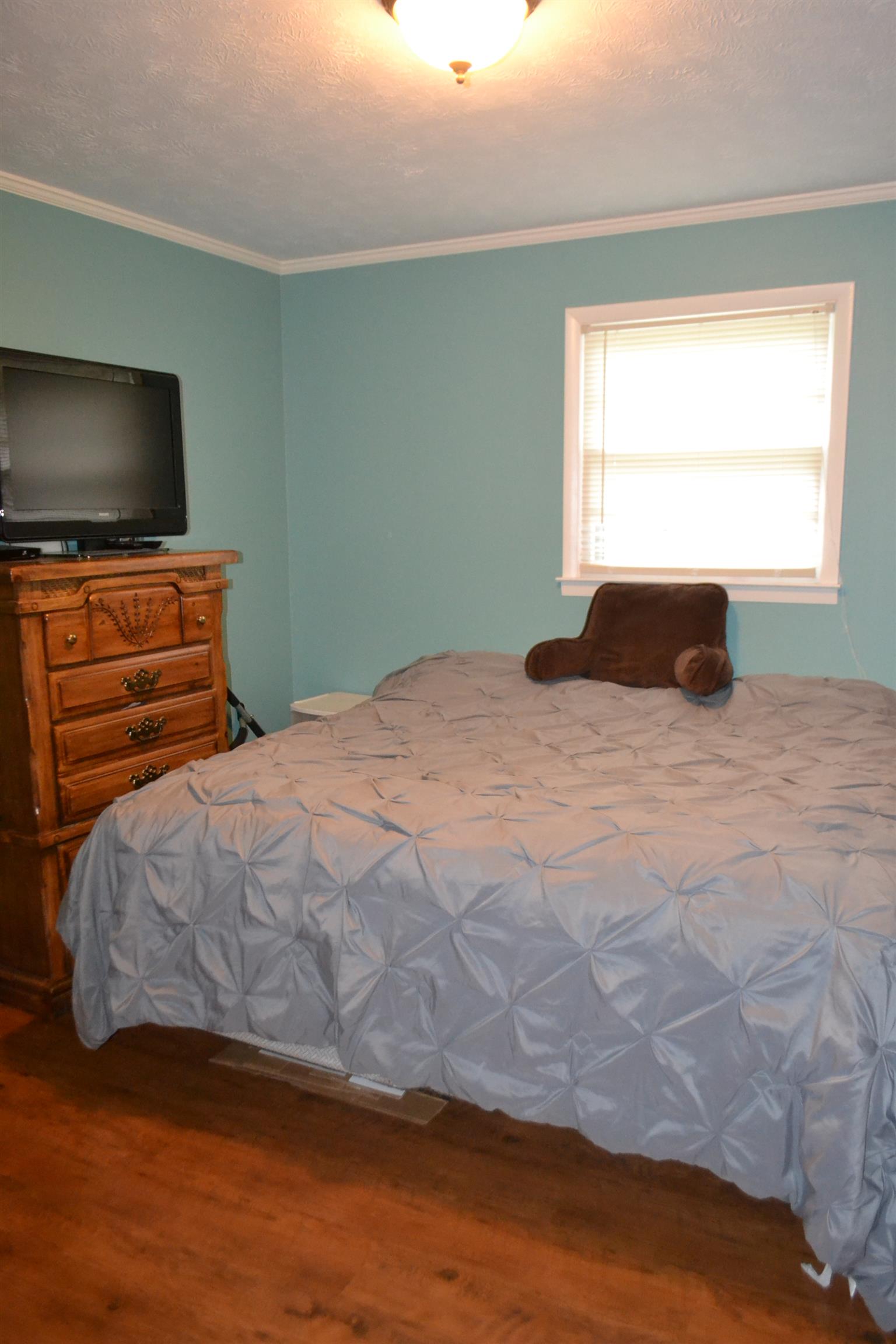 137 Rains Road Morrison, TN 37357 - Photo 13 of 24 a bedroom with a bed and a flat screen tv