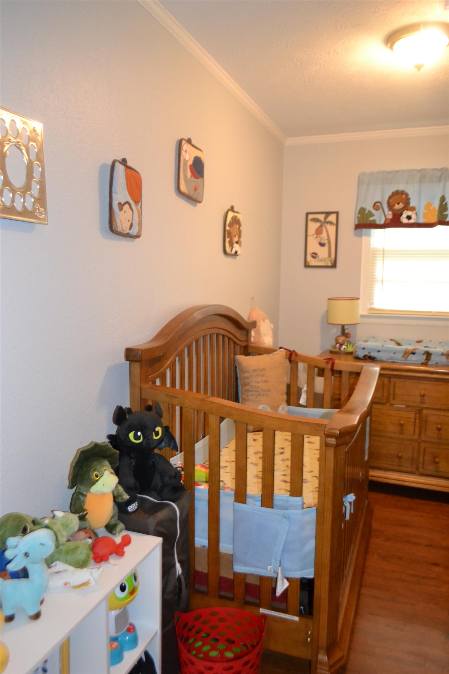 137 Rains Road Morrison, TN 37357 - Photo 18 of 24 a bedroom with a bed and wooden floor