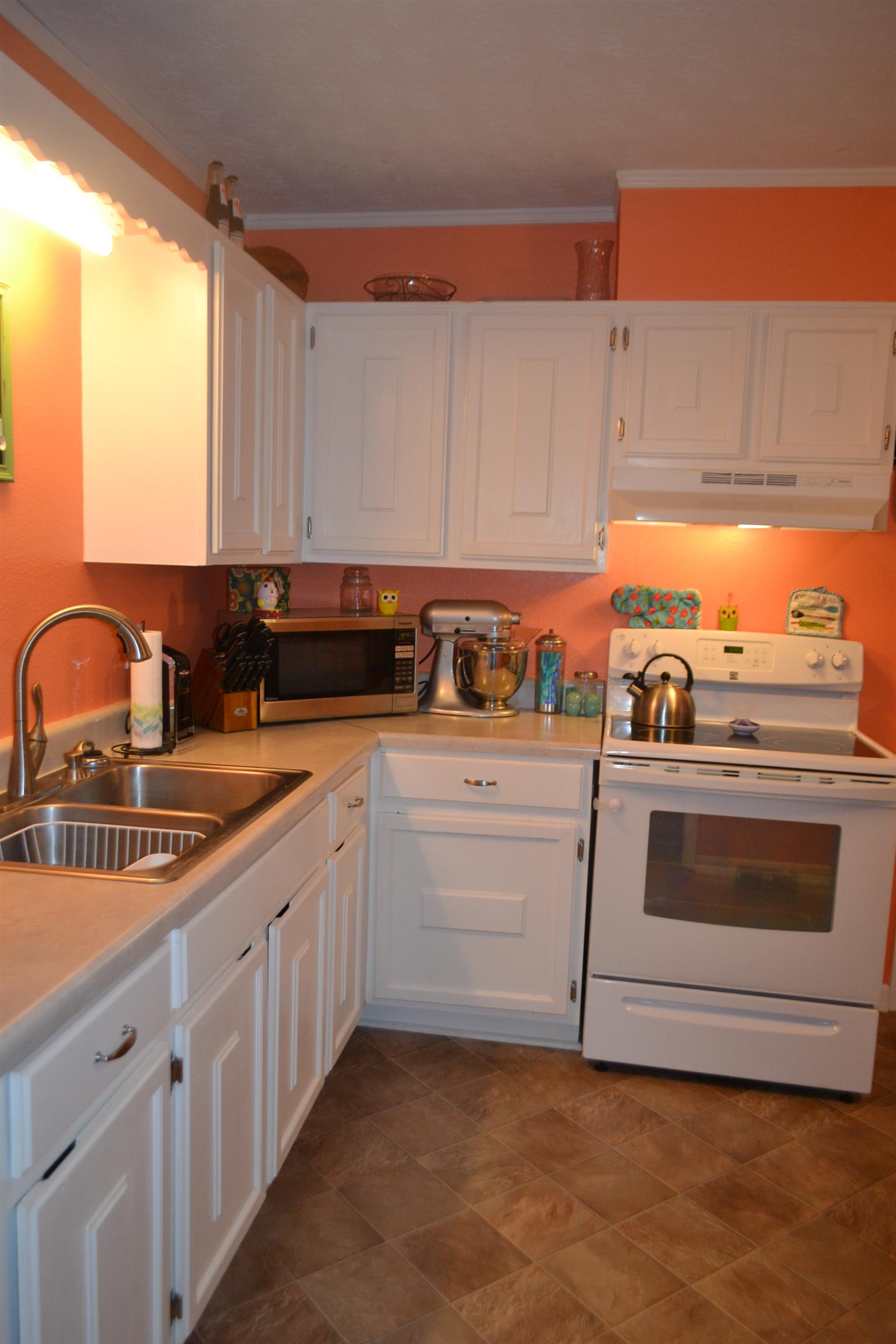 137 Rains Road Morrison, TN 37357 - Photo 9 of 24 a kitchen with granite countertop a sink and cabinets