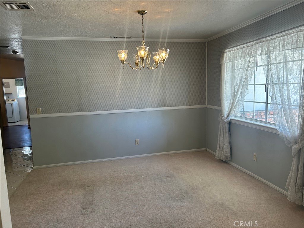 20187 Itasca Road Apple Valley, CA 92308 - Photo 6 of 35 a view of an empty room with a window