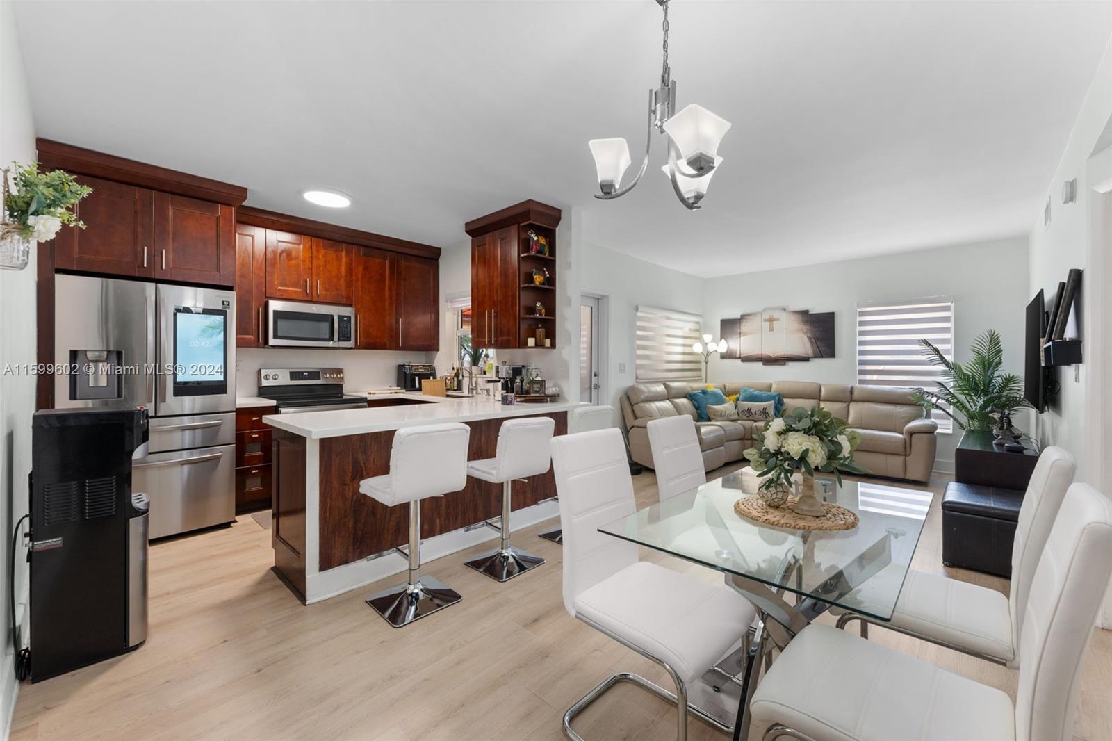 13926 Southwest 65th Terrace, Unit 3 Miami, FL 33183 - Photo 1 of 34 a view of kitchen with dining table and chairs