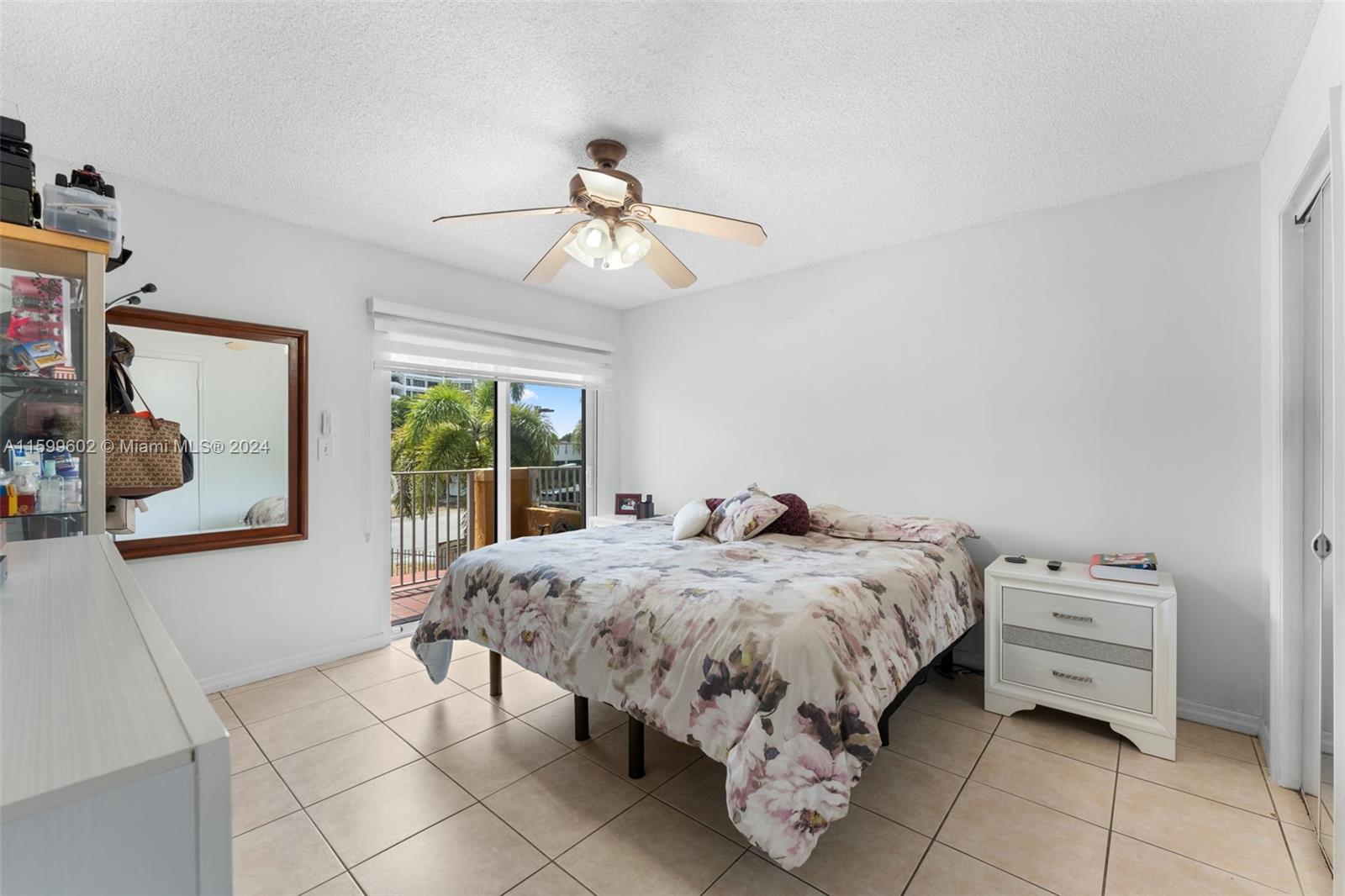 13926 Southwest 65th Terrace, Unit 3 Miami, FL 33183 - Photo 13 of 34 a bedroom with bed and window