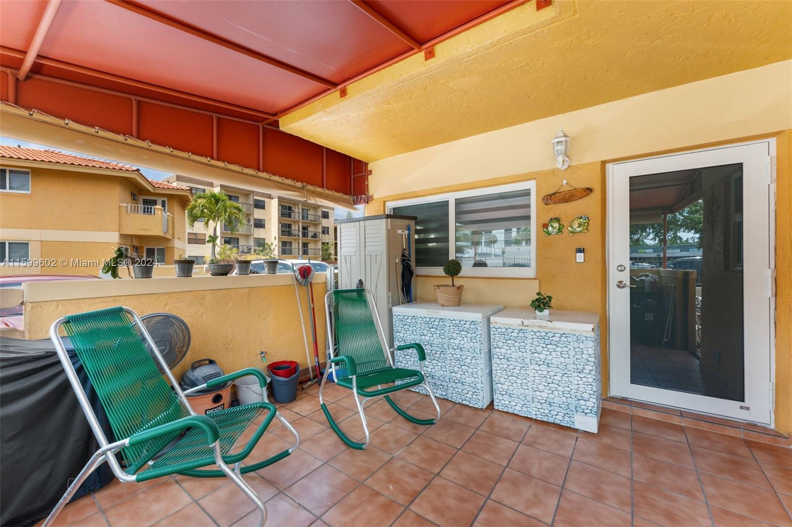 13926 Southwest 65th Terrace, Unit 3 Miami, FL 33183 - Photo 2 of 34 a view of a chairs in a patio
