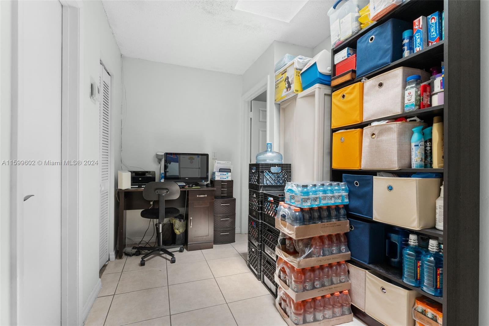 13926 Southwest 65th Terrace, Unit 3 Miami, FL 33183 - Photo 21 of 34 a room with furniture a flat screen tv and a window