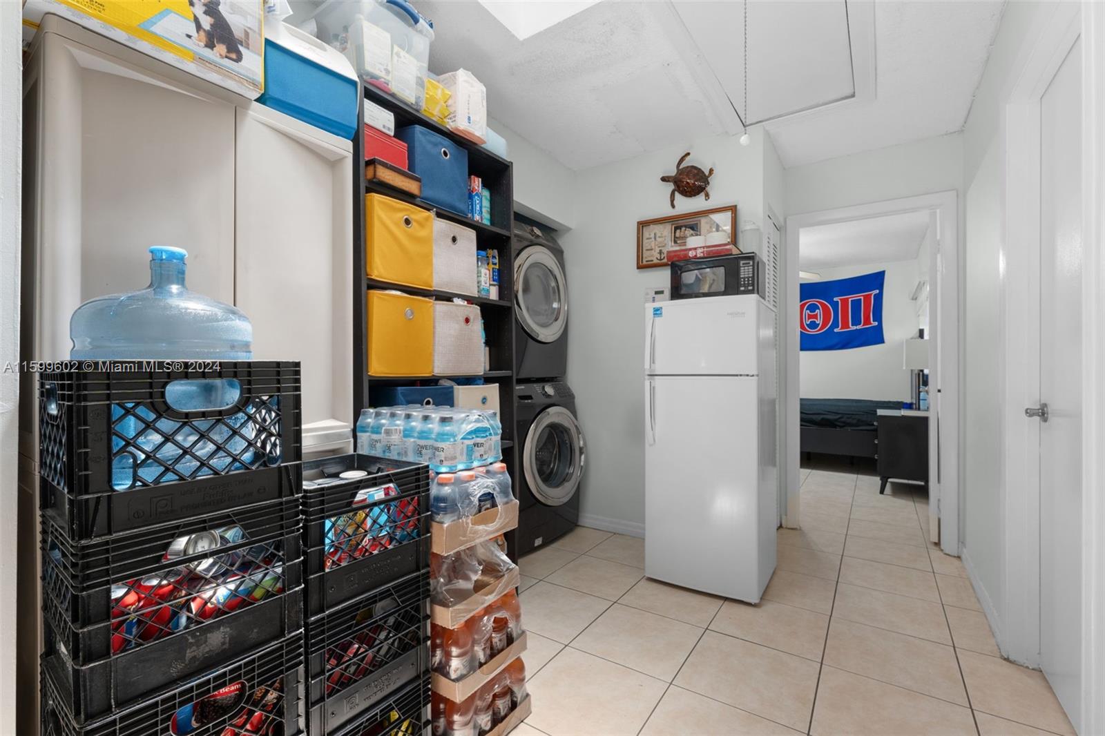 13926 Southwest 65th Terrace, Unit 3 Miami, FL 33183 - Photo 22 of 34 a utility room with dryer and washer