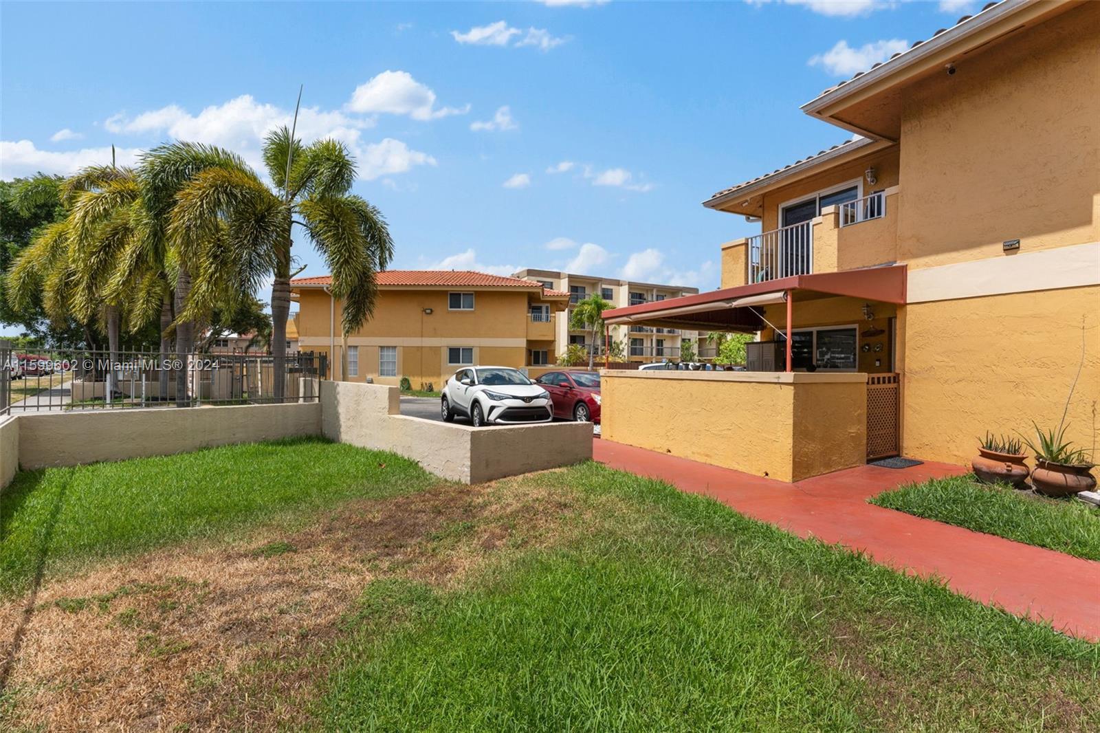 13926 Southwest 65th Terrace, Unit 3 Miami, FL 33183 - Photo 33 of 34 a swimming pool with outdoor seating and yard