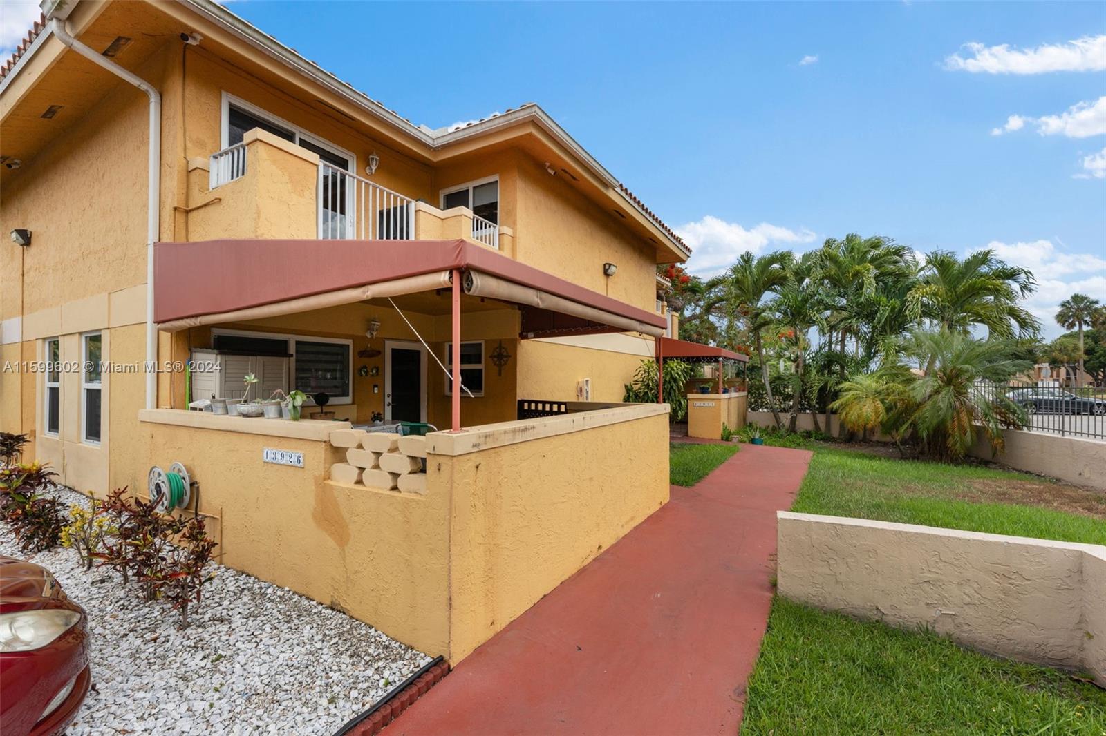 13926 Southwest 65th Terrace, Unit 3 Miami, FL 33183 - Photo 34 of 34 a front view of a house with garden