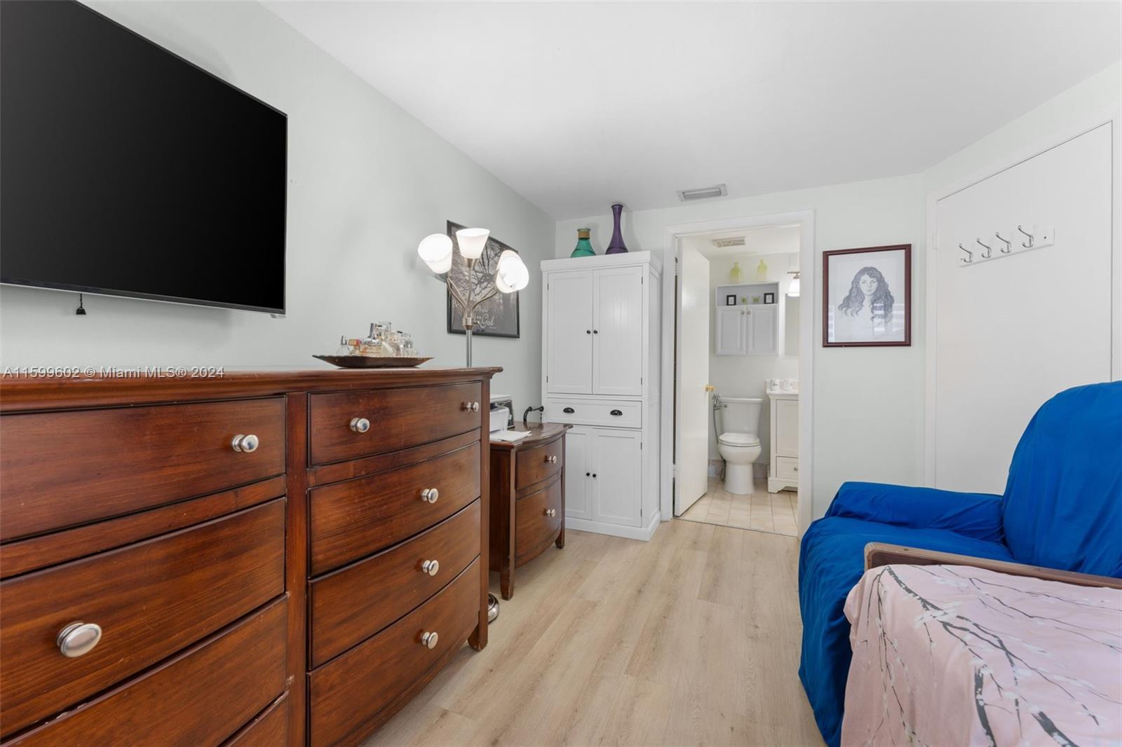 13926 Southwest 65th Terrace, Unit 3 Miami, FL 33183 - Photo 10 of 34 a living room with furniture and a flat screen tv