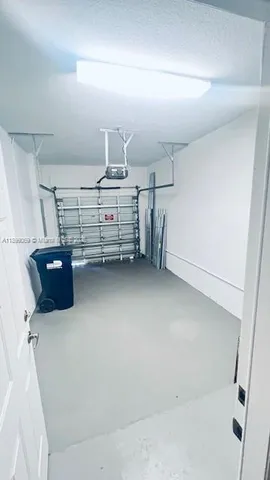 a bedroom with a bed and a night stand