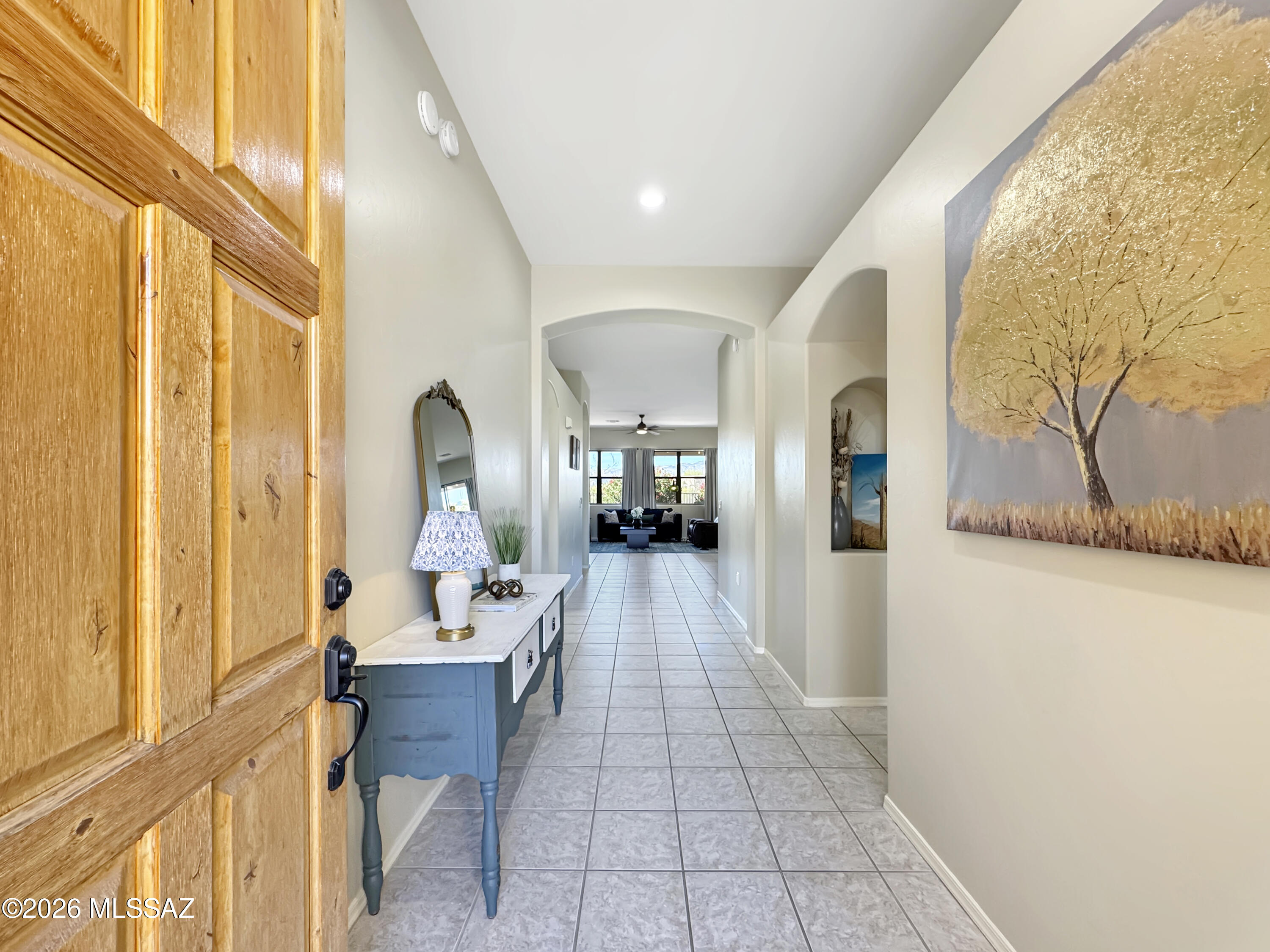10835 South Heart Break Ridge Place Vail, AZ 85641 - Photo 7 of 49 a hallway with a large mirror and furniture