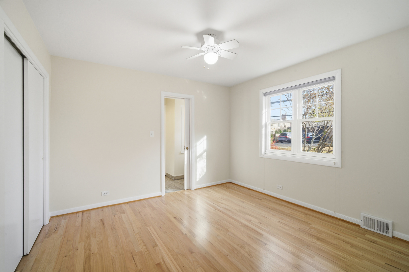 1700 Marguerite Street Park Ridge, IL 60068 - Photo 21 of 44 a view of an empty room with wooden floor and a window