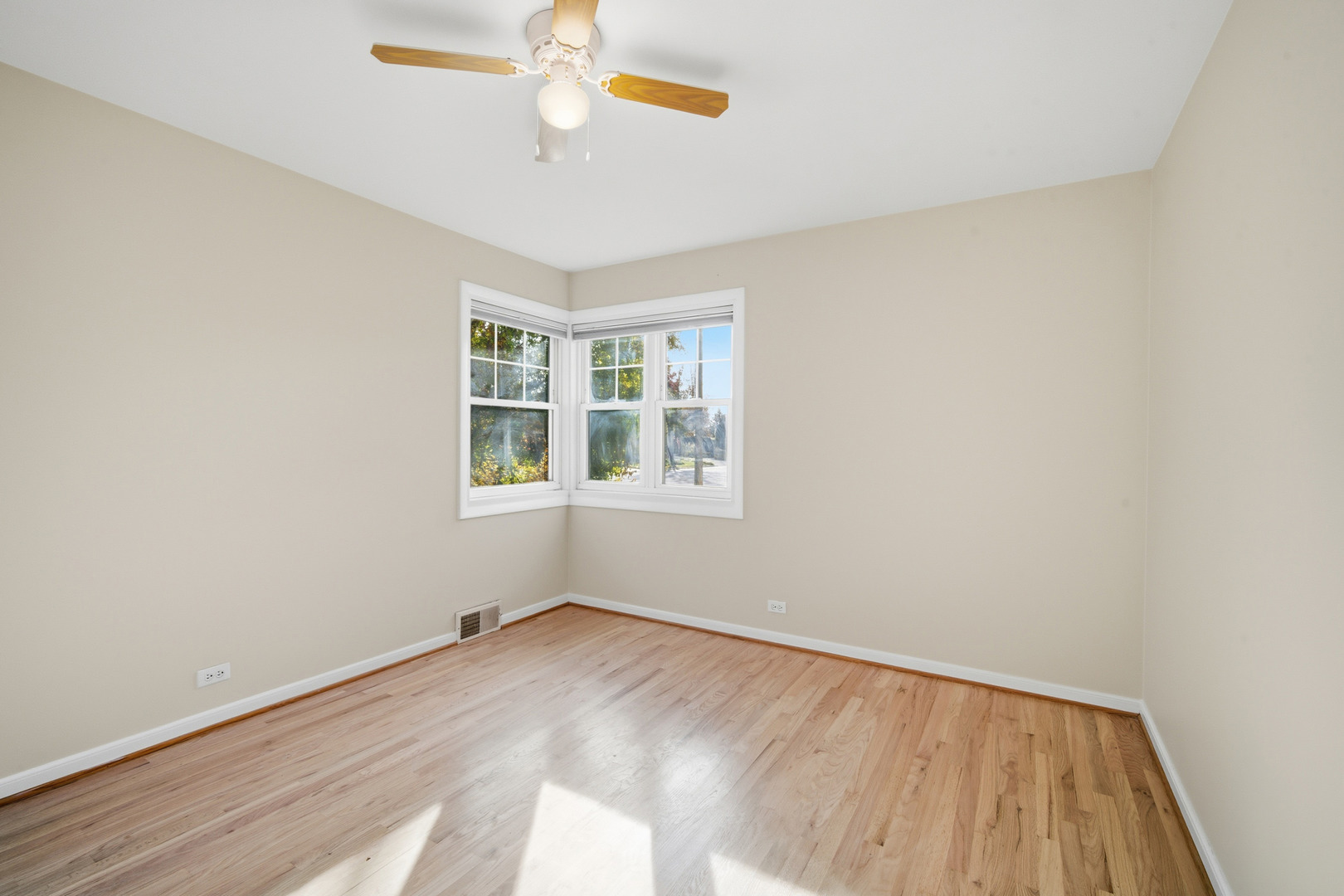 1700 Marguerite Street Park Ridge, IL 60068 - Photo 22 of 44 a view of an empty room with a window and wooden floor