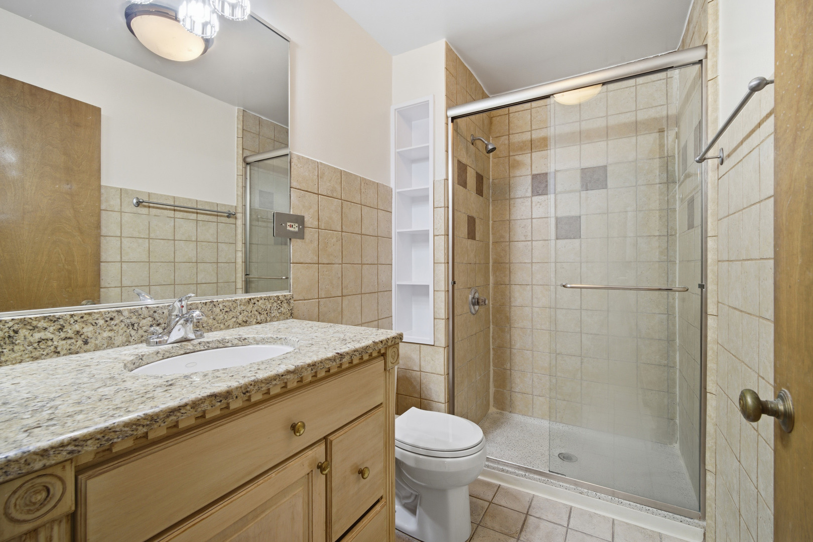 1700 Marguerite Street Park Ridge, IL 60068 - Photo 25 of 44 a bathroom with a granite countertop sink toilet and shower