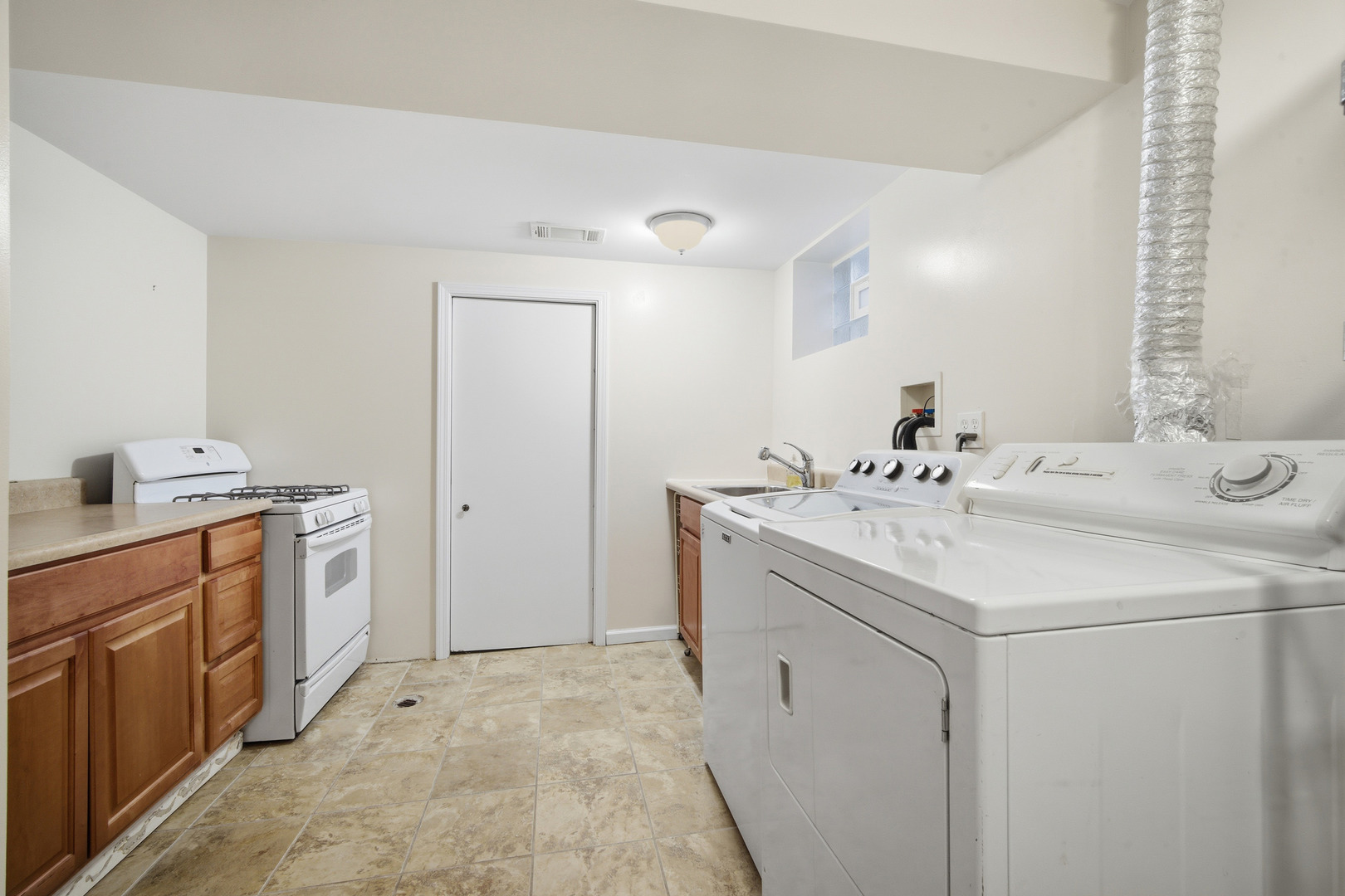 1700 Marguerite Street Park Ridge, IL 60068 - Photo 32 of 44 a utility room with cabinets washer and dryer