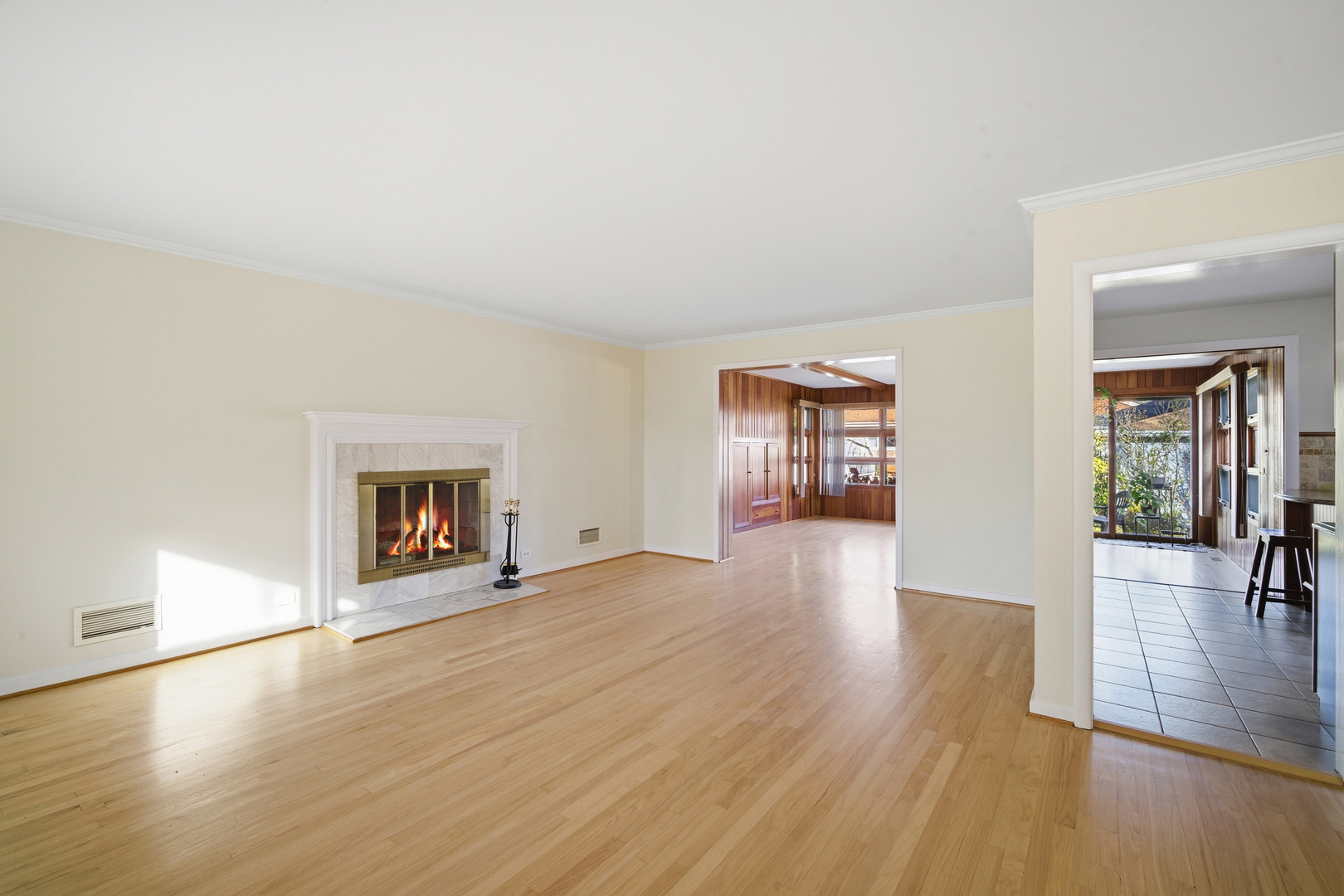 1700 Marguerite Street Park Ridge, IL 60068 - Photo 4 of 44 an empty room with wooden floor and fireplace