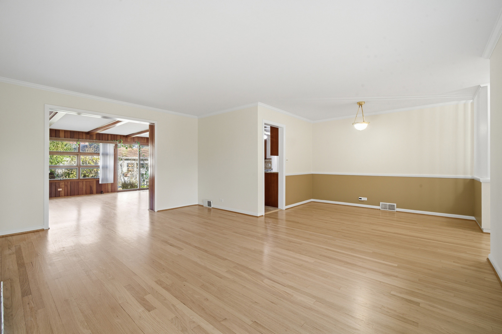 1700 Marguerite Street Park Ridge, IL 60068 - Photo 7 of 44 a view of an empty room with wooden floor and a window