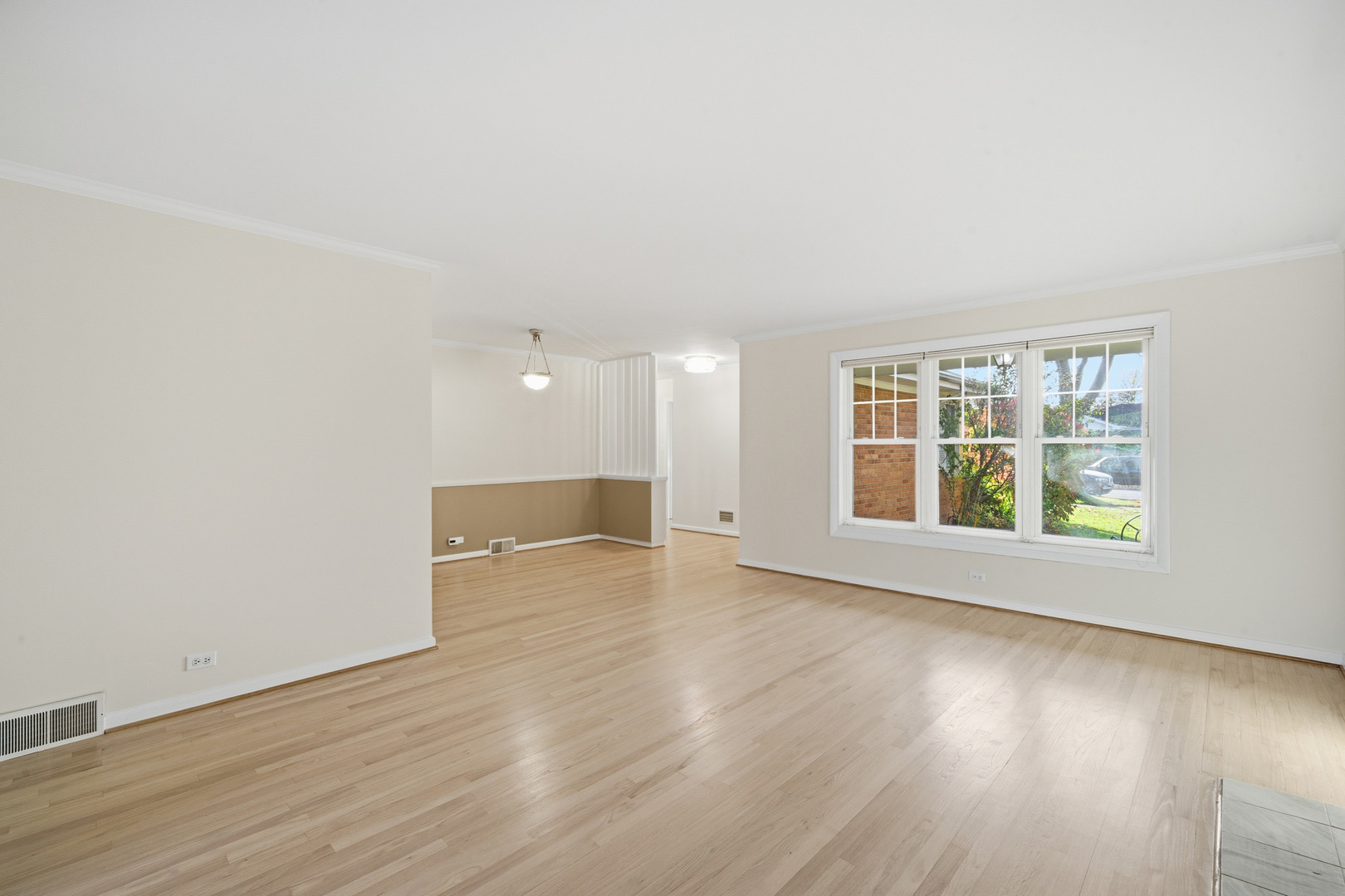 1700 Marguerite Street Park Ridge, IL 60068 - Photo 9 of 44 an empty room with wooden floor and windows