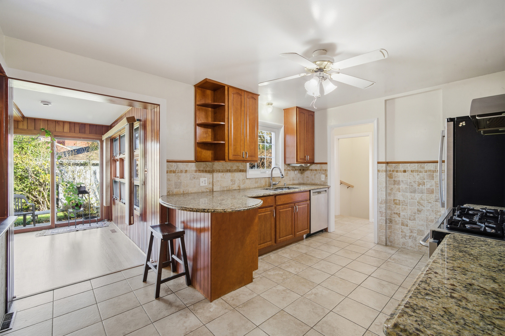 1700 Marguerite Street Park Ridge, IL 60068 - Photo 10 of 44 a kitchen with kitchen island granite countertop a sink appliances and cabinets