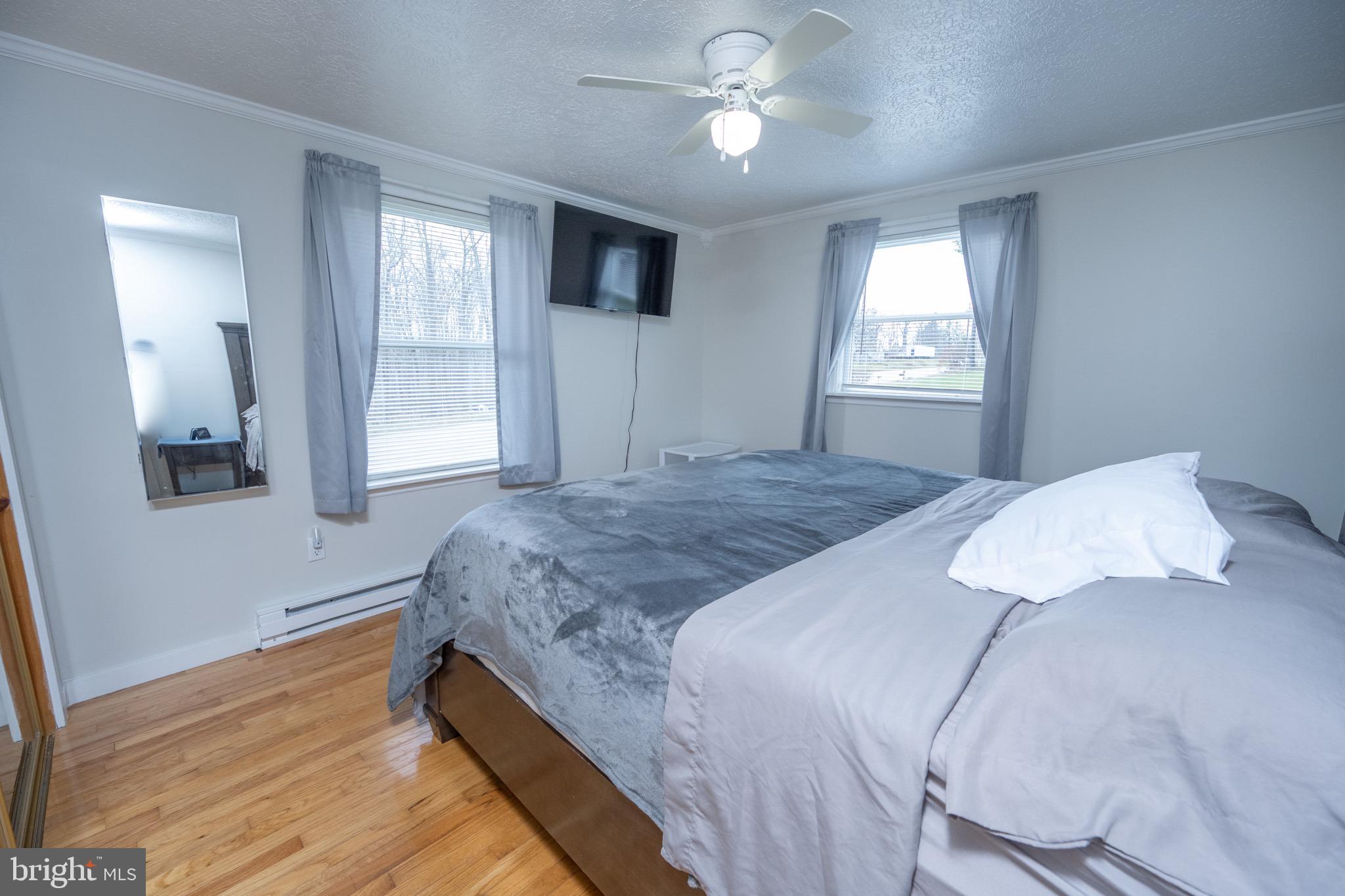 18 Ollie North Road Oakland, MD 21550 - Photo 13 of 48 a bedroom with a large bed and a window