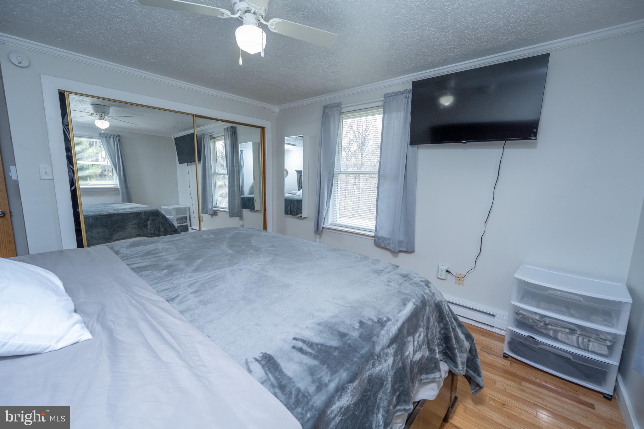 18 Ollie North Road Oakland, MD 21550 - Photo 14 of 48 a bedroom with a bed and a flat screen tv