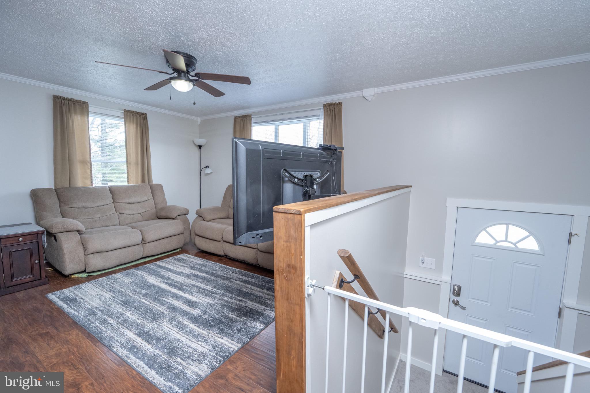 18 Ollie North Road Oakland, MD 21550 - Photo 20 of 48 a living room with furniture and a chandelier