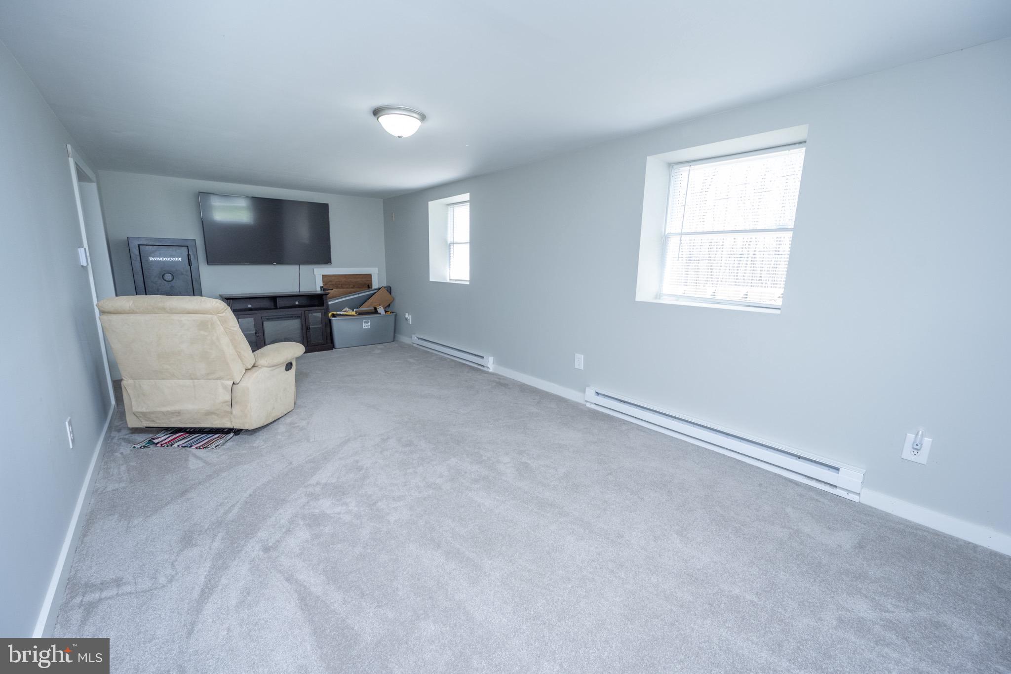 18 Ollie North Road Oakland, MD 21550 - Photo 34 of 48 a living room with furniture and a flat screen tv