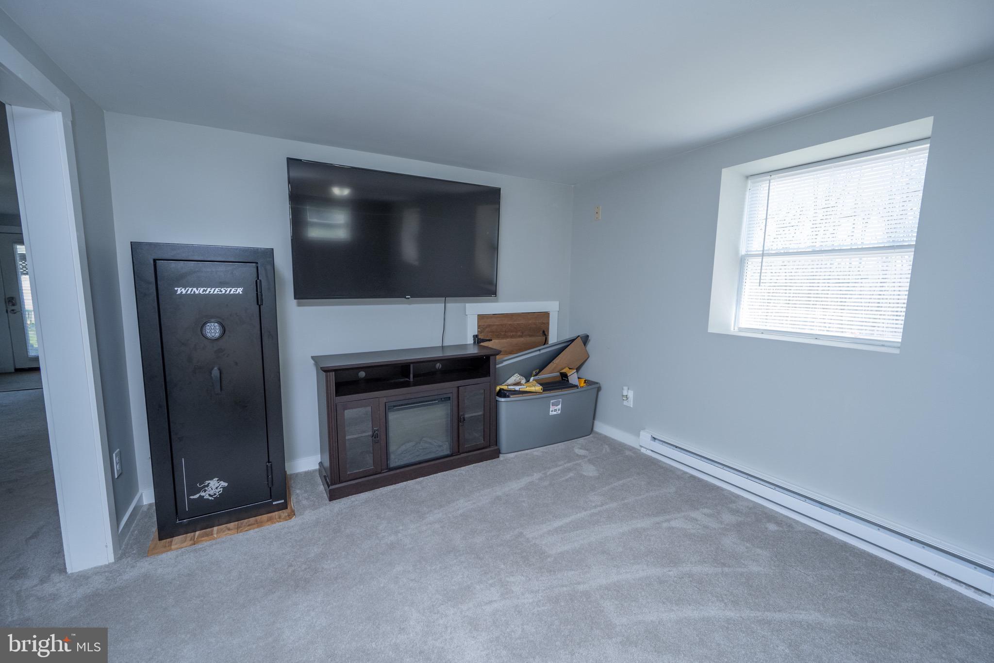 18 Ollie North Road Oakland, MD 21550 - Photo 35 of 48 a living room with stainless steel appliances kitchen island a stove and a refrigerator