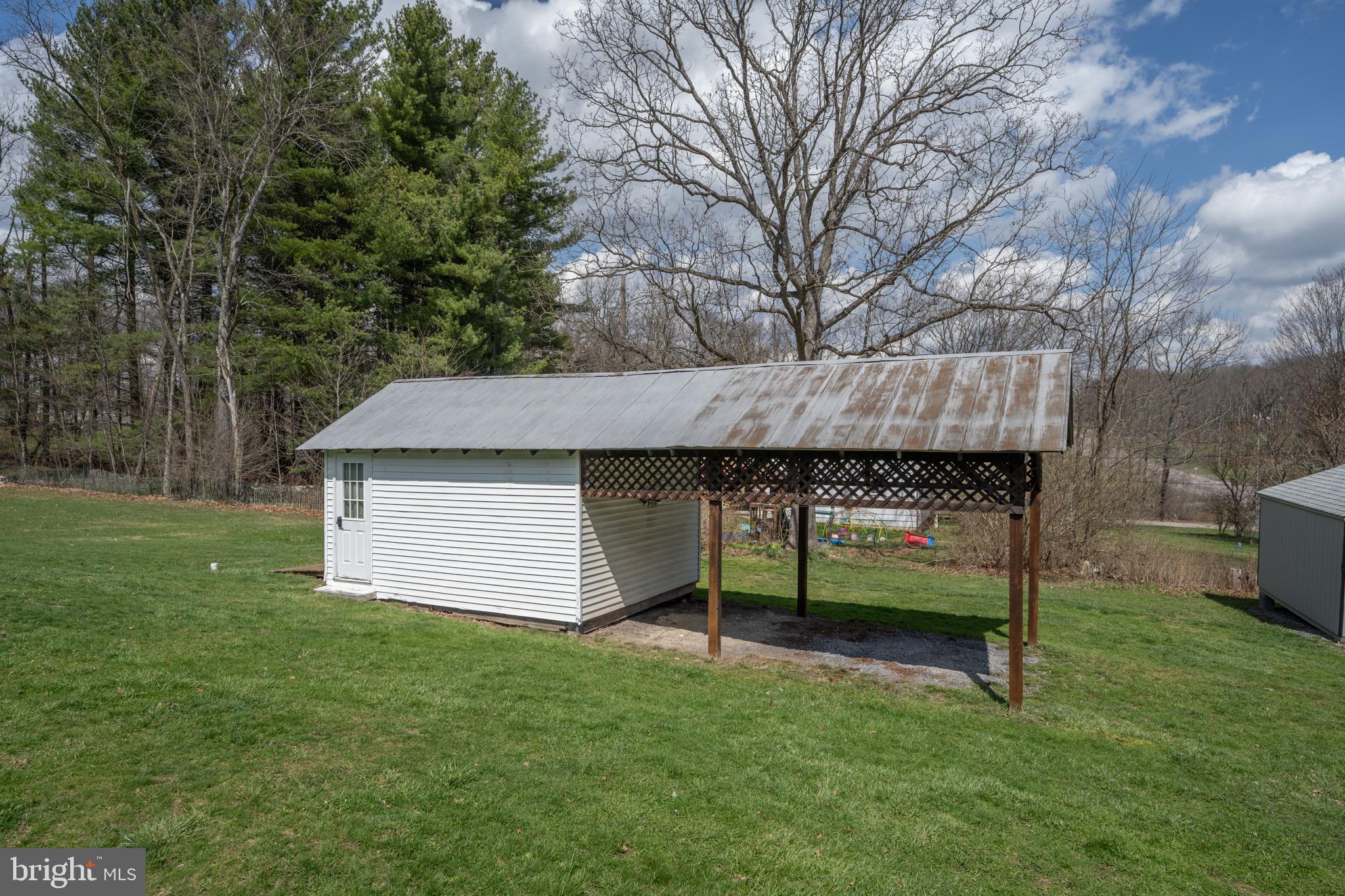 18 Ollie North Road Oakland, MD 21550 - Photo 41 of 48 a view of backyard with large trees and a barn
