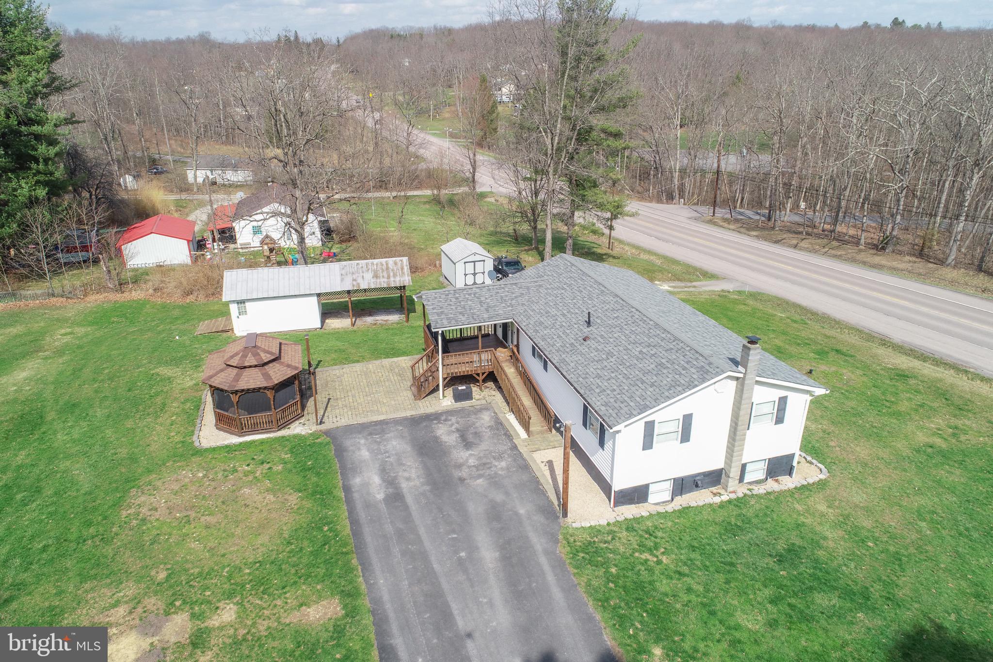 18 Ollie North Road Oakland, MD 21550 - Photo 46 of 48 a aerial view of a house with a yard and furniture