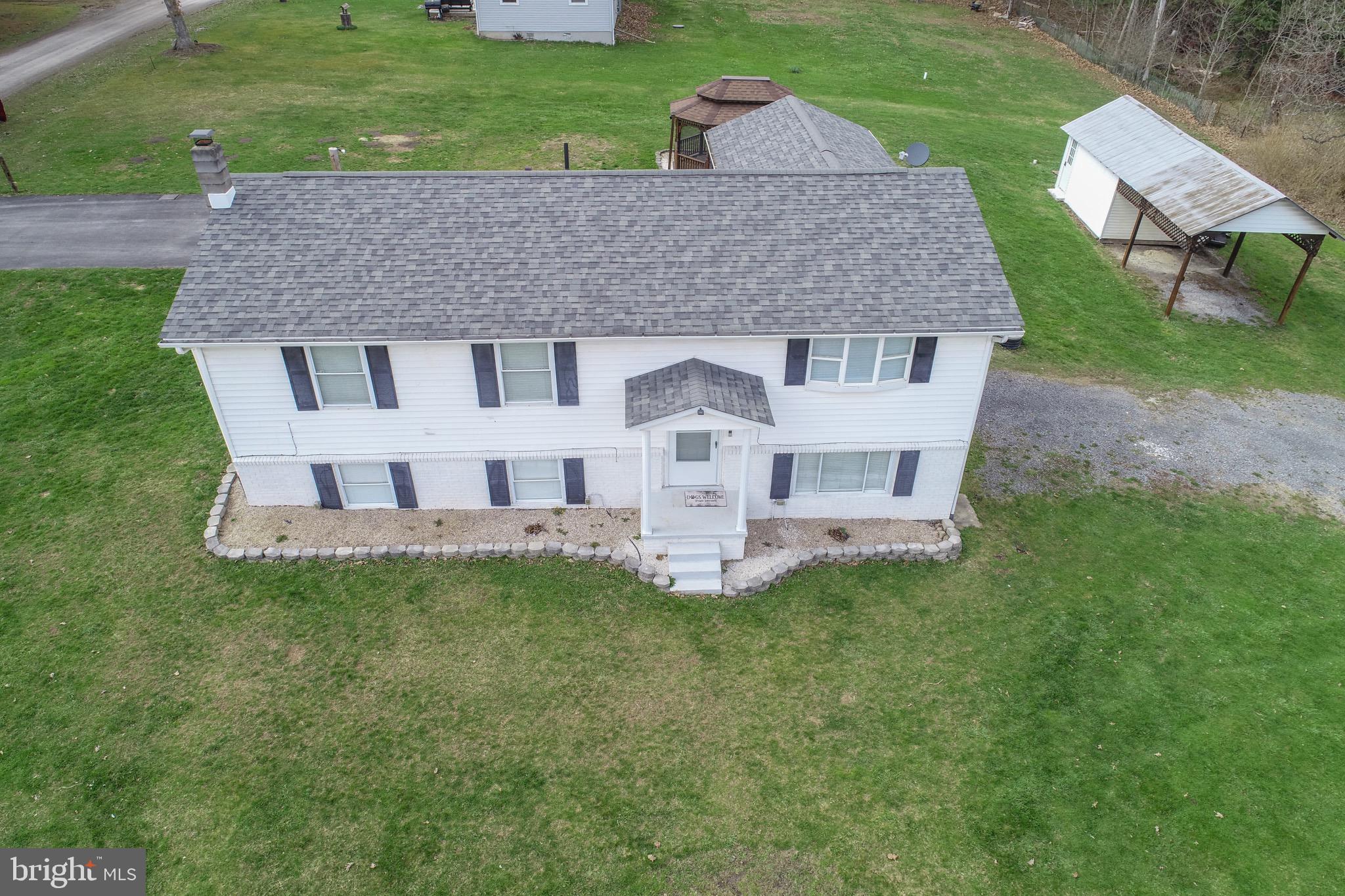 18 Ollie North Road Oakland, MD 21550 - Photo 47 of 48 a aerial view of a house with a yard deck and a slide