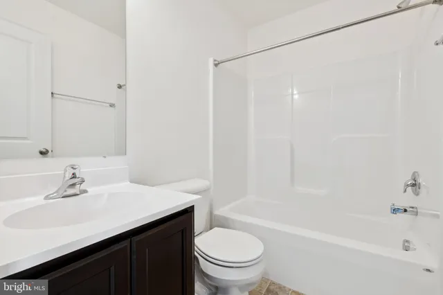 a bathroom with a sink a toilet and a bathtub