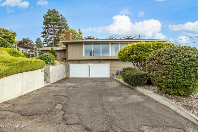 an aerial view of a house with a garden