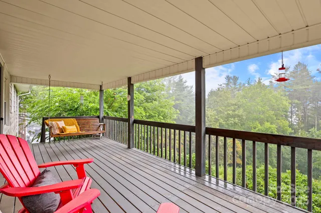 a view of a two chairs in the balcony