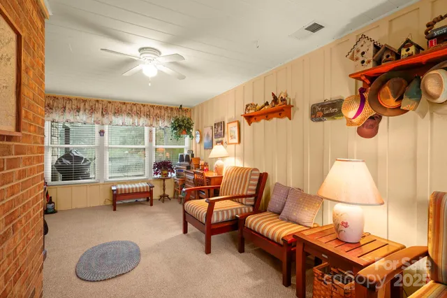 a living room with furniture and a lamp