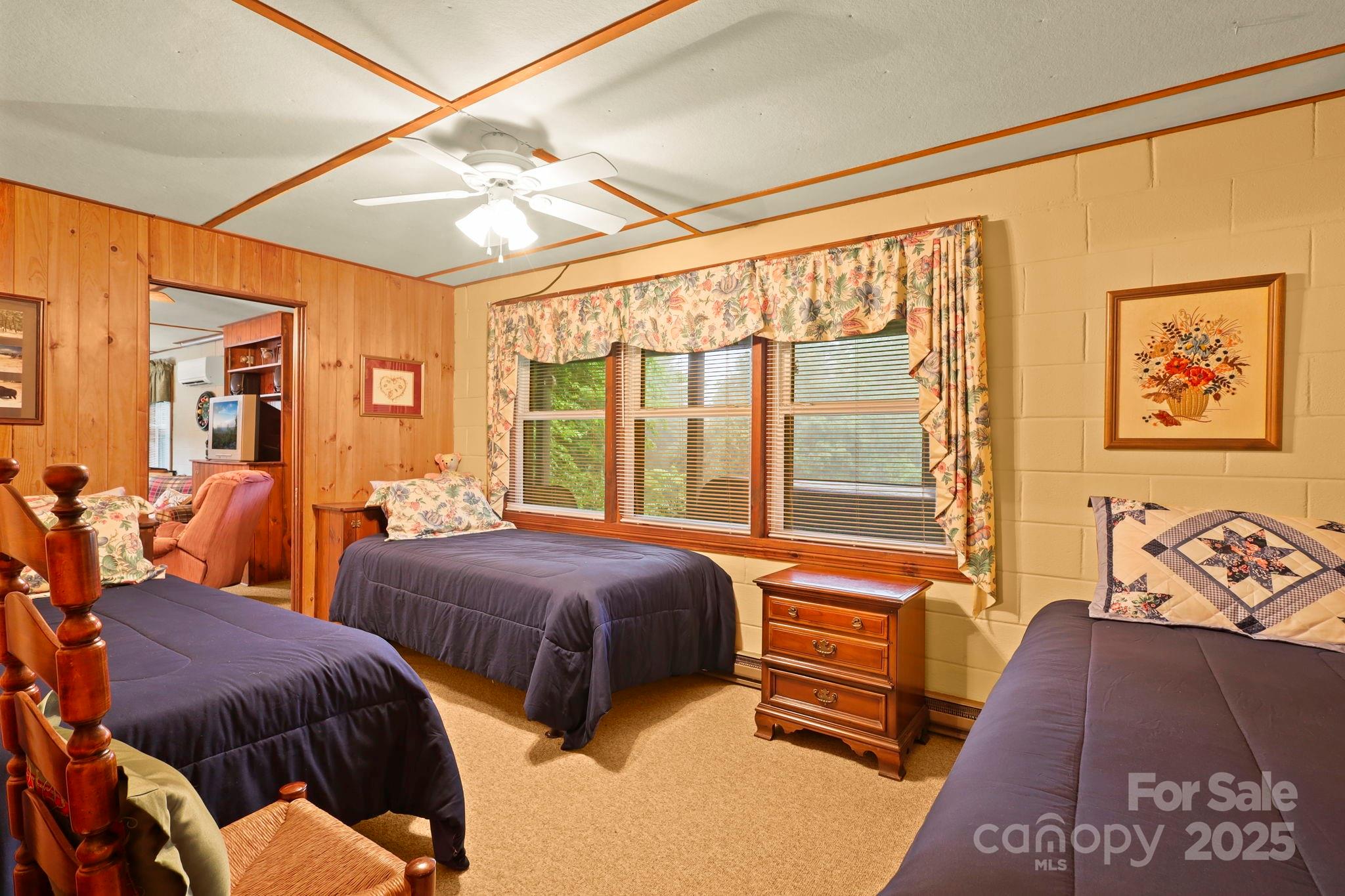 1074 Nikanor Road West Jefferson, NC 28694 - Photo 35 of 45 a bedroom with two beds and a large window