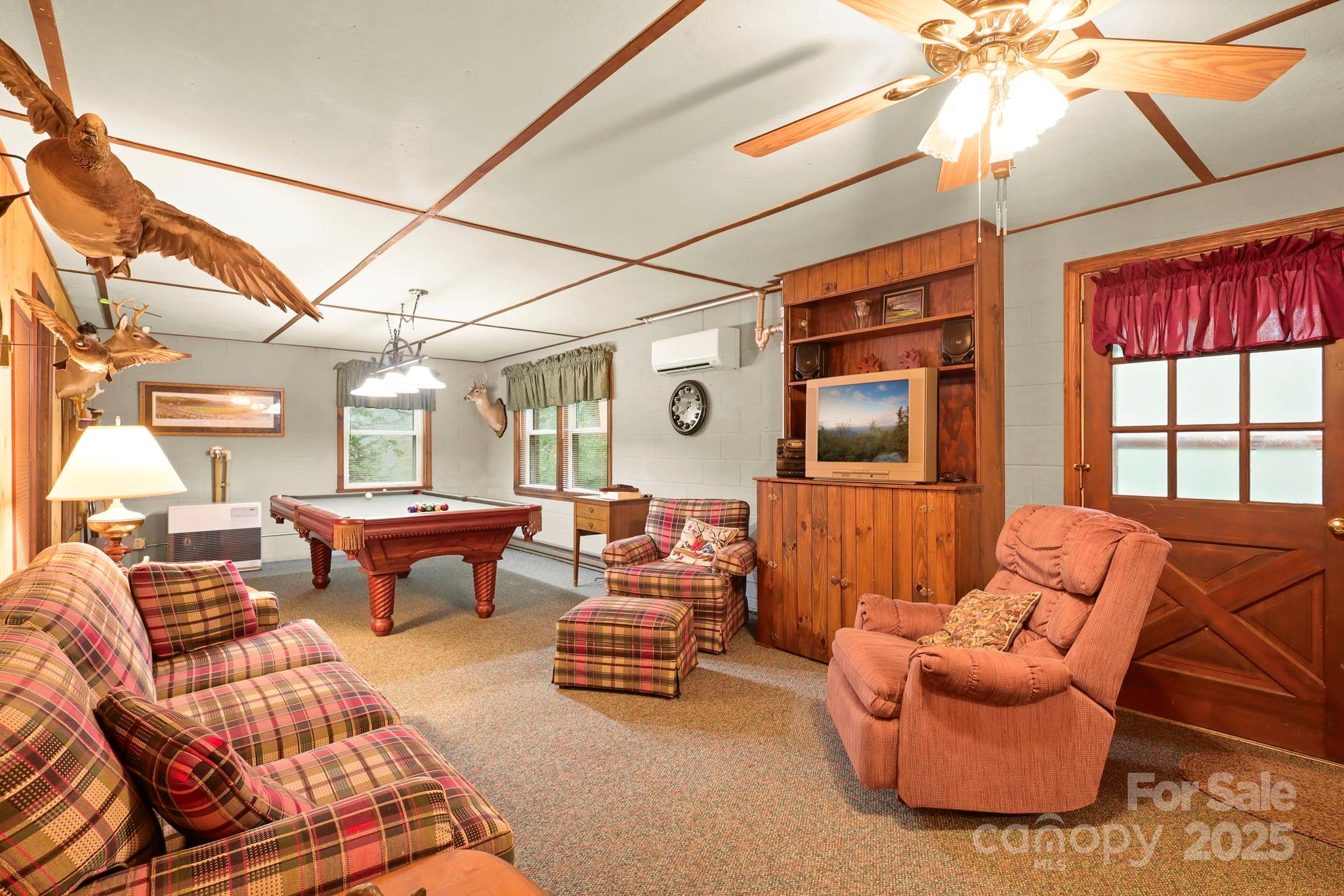 1074 Nikanor Road West Jefferson, NC 28694 - Photo 37 of 45 a outdoor living space with furniture and a flat screen tv