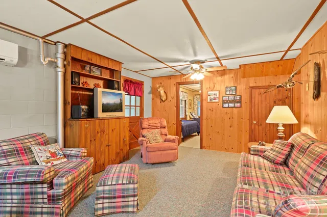 a bedroom with furniture and a window