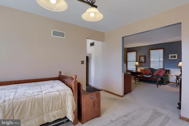 a bed room with a bed and a large window