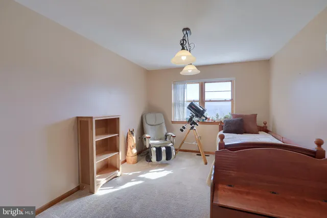 a bed room with a bed and a window