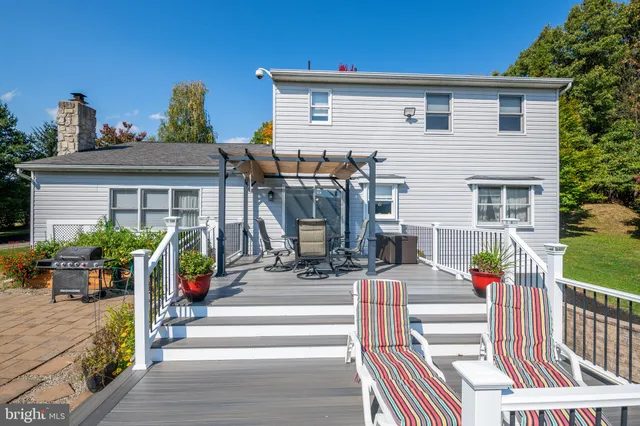 a front view of house with an outdoor seating