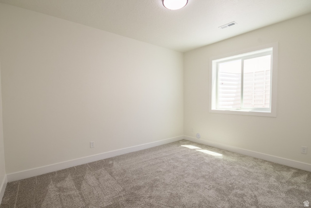 3322 250 S Street Vernal, UT 84078 - Photo 23 of 37 Room featuring a single window with white trim, light-colored walls, and gray carpet flooring