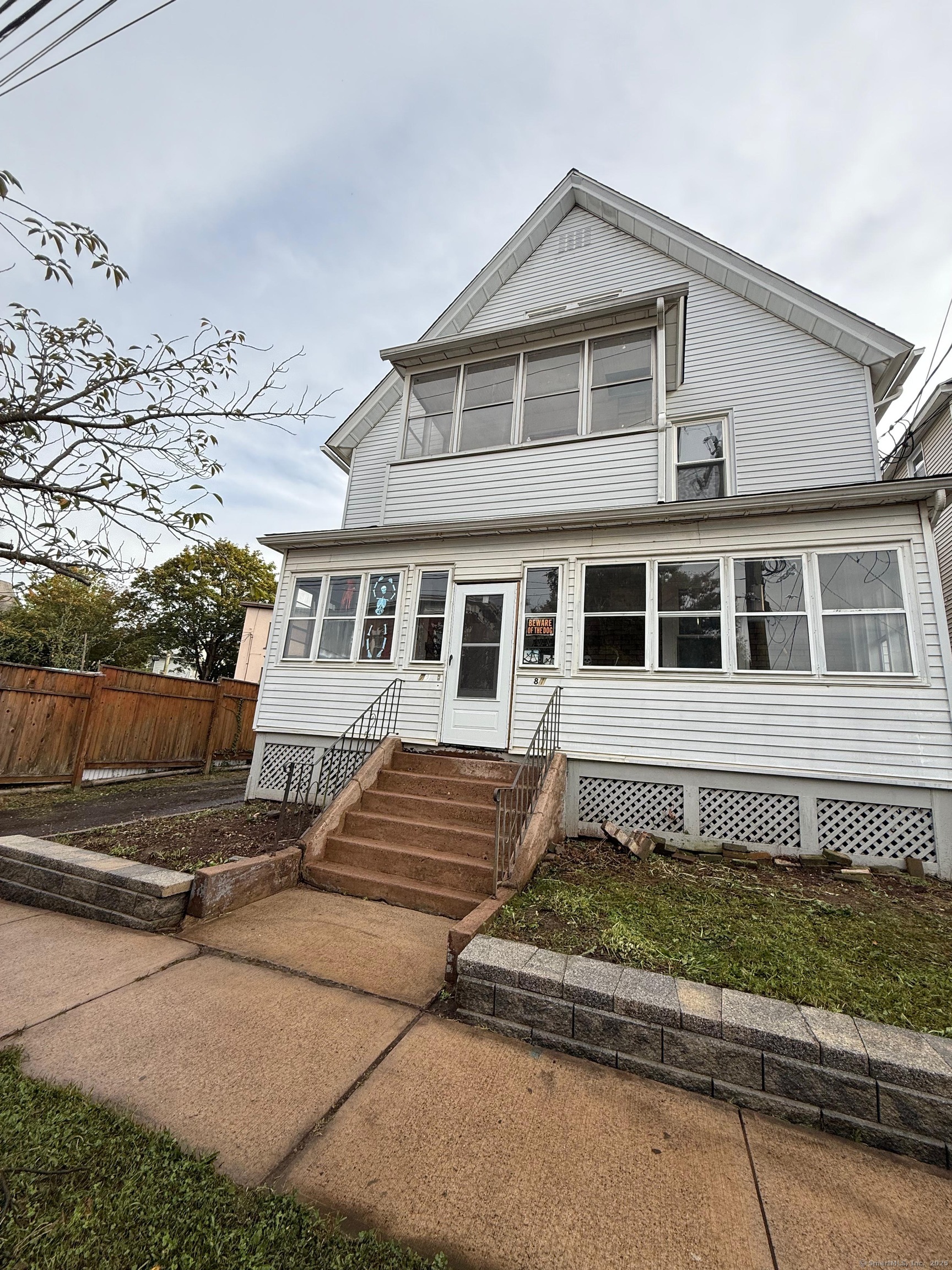 79 Spring Street, Unit 2 Middletown, CT 06457 - Photo 1 of 15 a front view of a house with a yard
