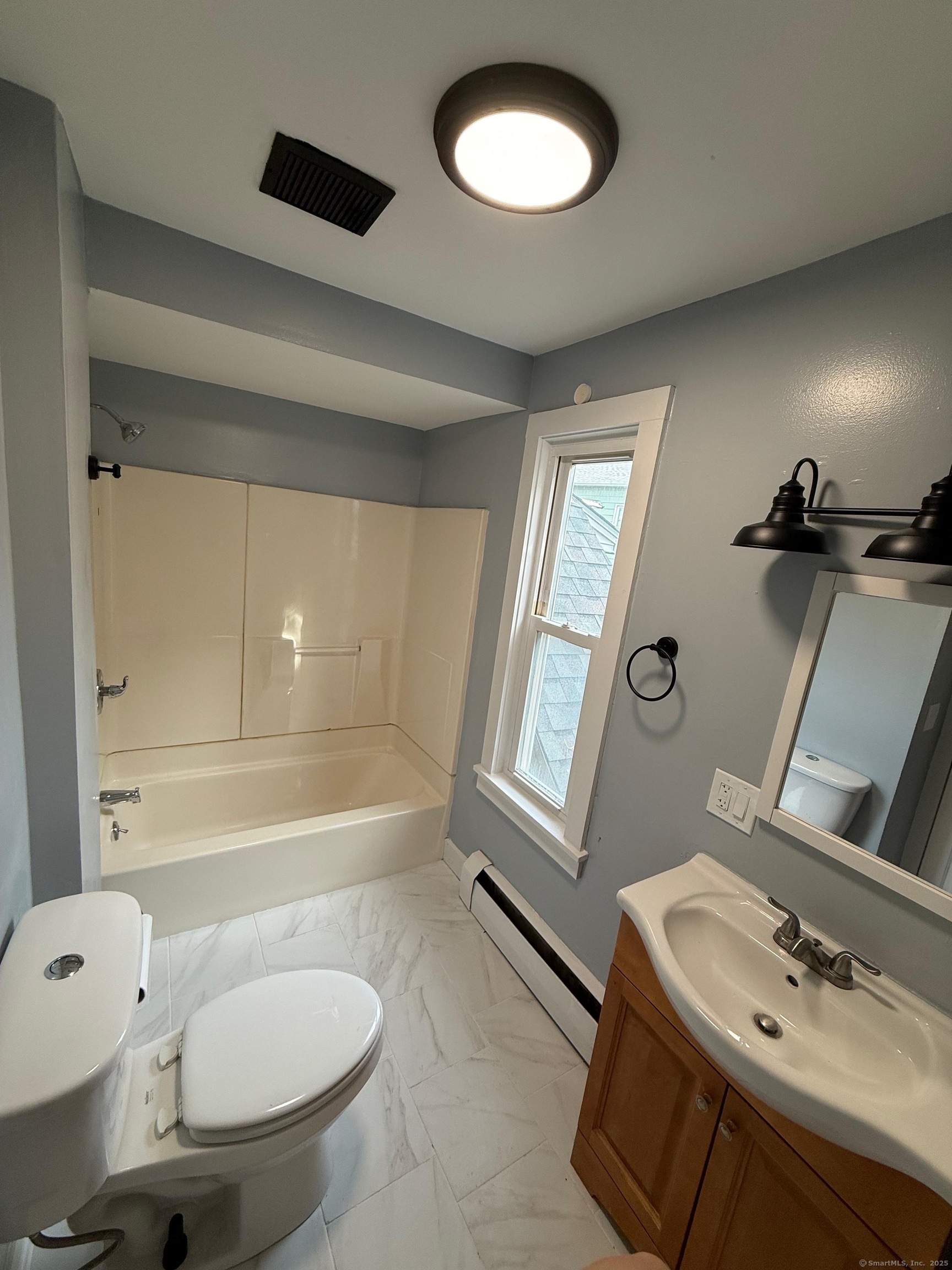 79 Spring Street, Unit 2 Middletown, CT 06457 - Photo 4 of 15 a bathroom with a sink and a mirror
